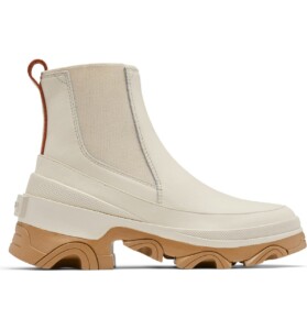 White waterproof winter boot with lug sole. 