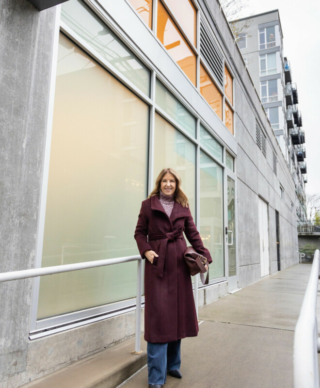 Burgundy longline coat with turtleneck and wide-leg jeans