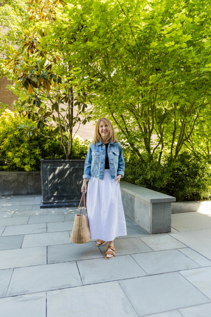 White skirt, denim jacket, tank and cognac shoes