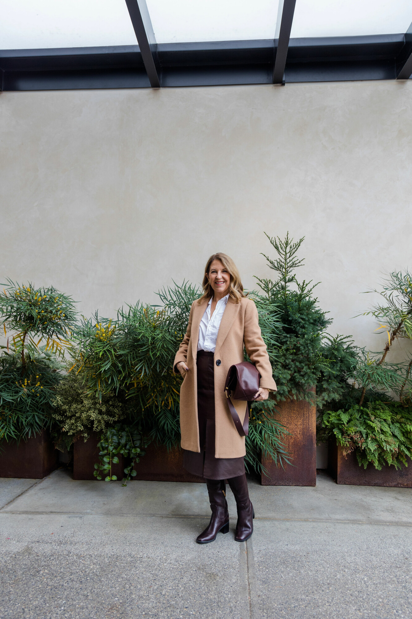 Untuck it faux leather skirt, white button up, boots, camel coat