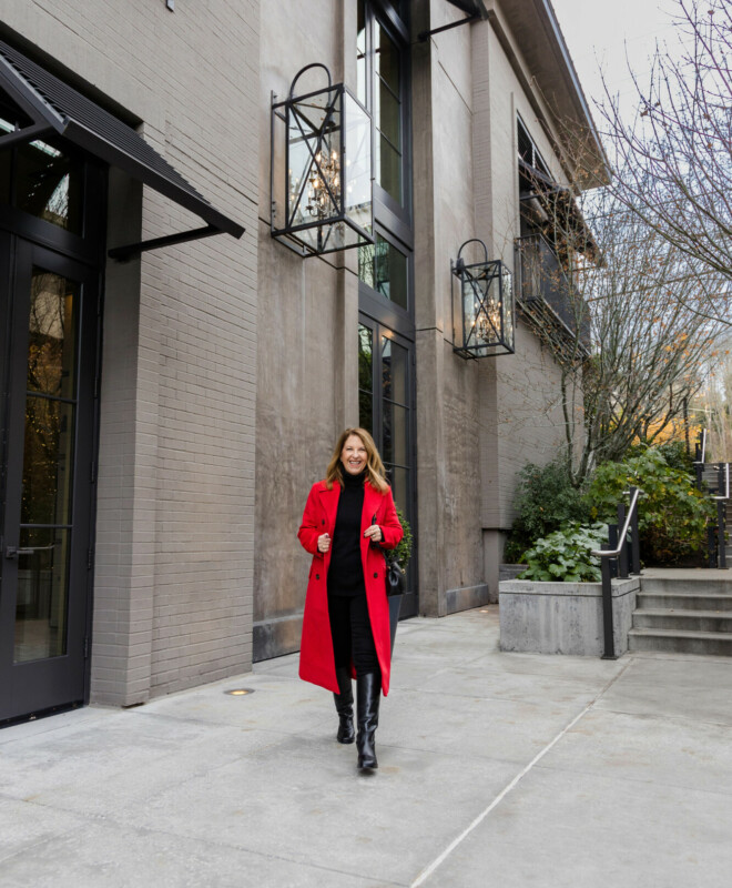 red longline coat and tall boots