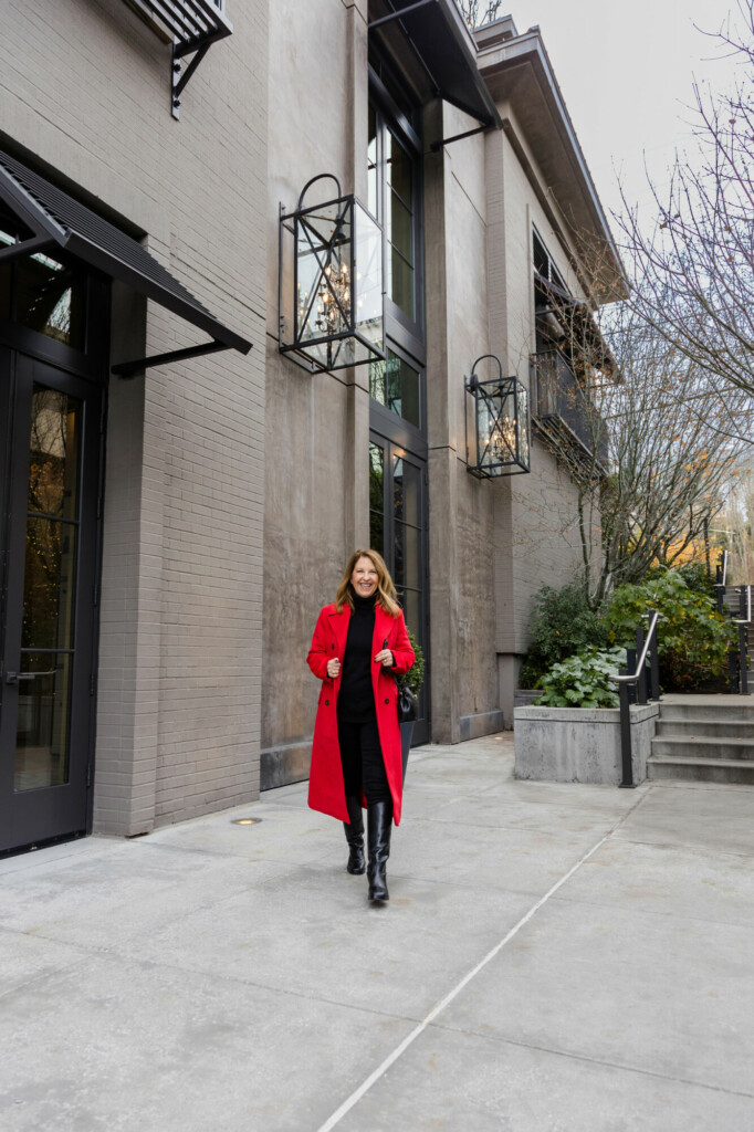 red longline coat and tall boots