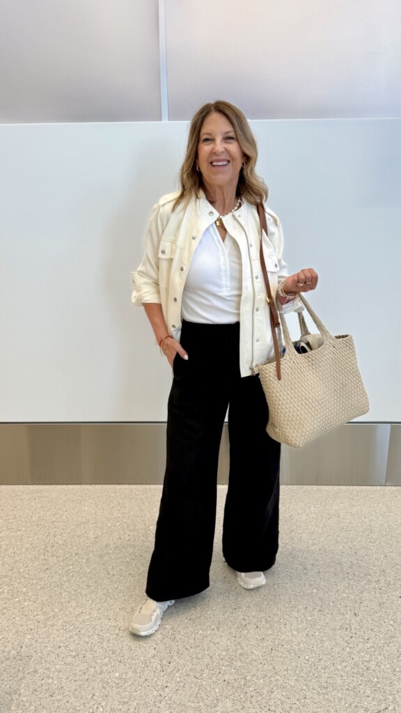 travel outfit, Aritzia lodge pants, a rail top, and a jacket.